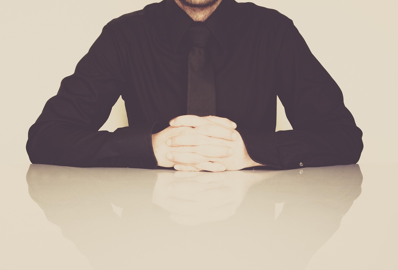Businessman, office, necktie — Analyze the advantages and disadvantages of a security system